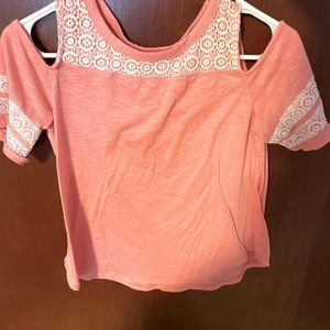 Pink shirt with white designs